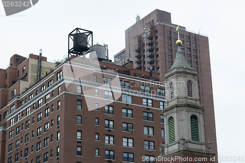 Image of Wtertowers by a church