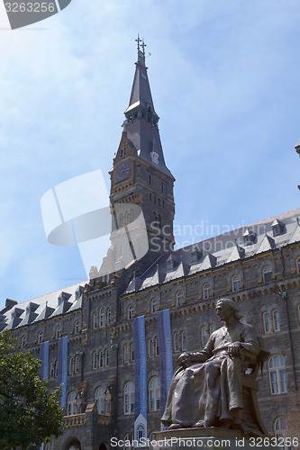 Image of Tower of Georgetown University with the statue of John Carroll