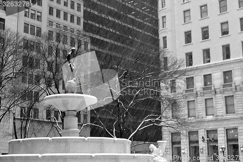 Image of Pulitzer Fountain under the snow in black and white