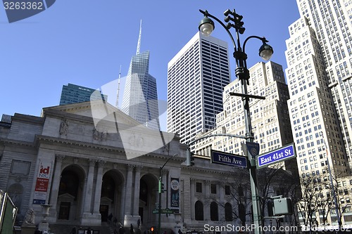 Image of NY public library façade with Bryant park on the background