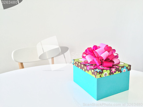 Image of Bright gift box on white table