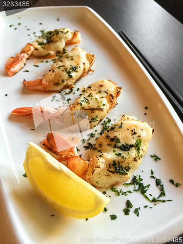 Image of Grilled shrimps on a white plate