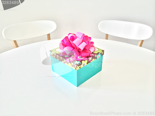 Image of Colorful gift box on white table