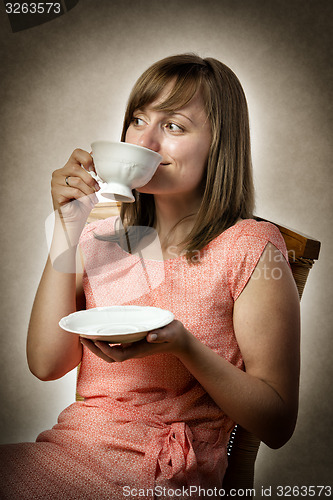 Image of Woman drinking tea
