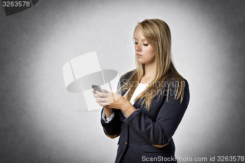 Image of Businesswoman writes text messages