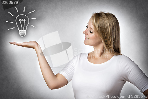 Image of Creative woman with bulb