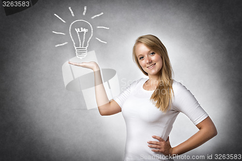 Image of Creative woman with bulb