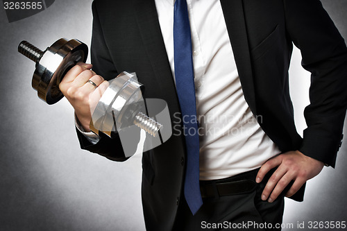 Image of businessman with dumbbell