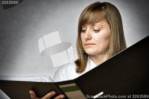 Image of Female office worker with folder