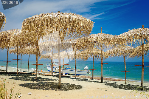 Image of Reed umbrellas on the beach