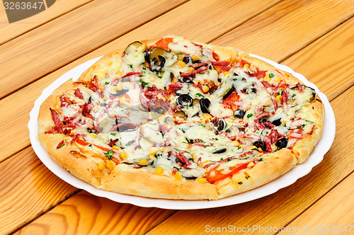 Image of Pizza with pepperoni, black olives and corn