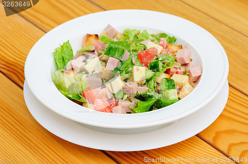 Image of salad with cheese, ham and fresh vegetables