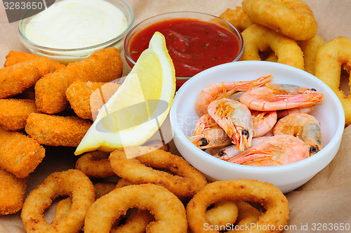 Image of beer snack, shrimps, calmar rings and fish sticks
