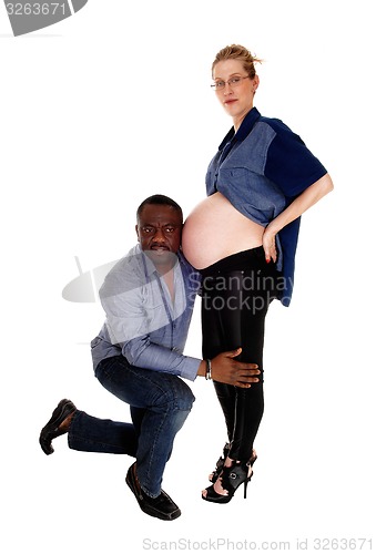 Image of Black man with pregnant Caucasian wife.