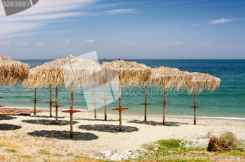 Image of Reed umbrellas on the beach