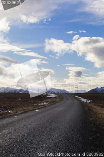 Image of Snowy volcano landscape with dramatic clouds in Iceland