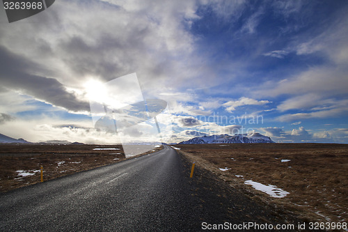 Image of Snowy volcano landscape with dramatic clouds in Iceland