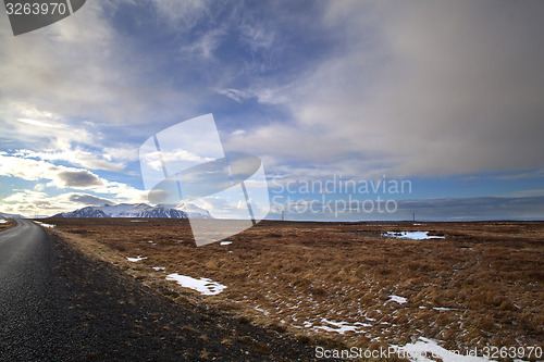 Image of Snowy volcano landscape with dramatic clouds in Iceland