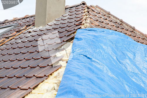 Image of renovation of a brick tiled roof