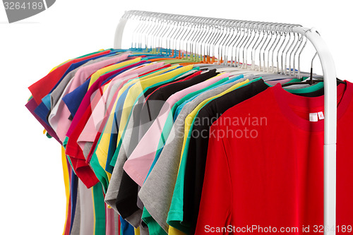 Image of Colored shirts on hangers steel.