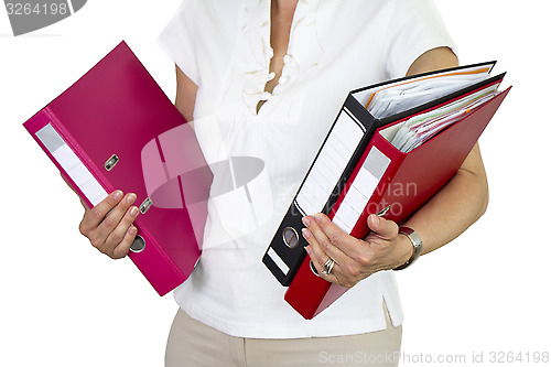 Image of Secretary holding binders