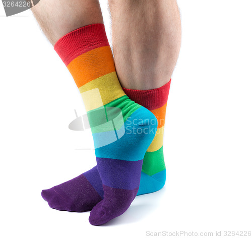 Image of Men\'s hairy legs in colored striped socks fun