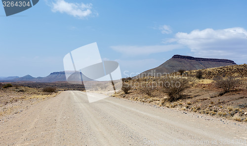 Image of endless road in Namibia moonscape landscape