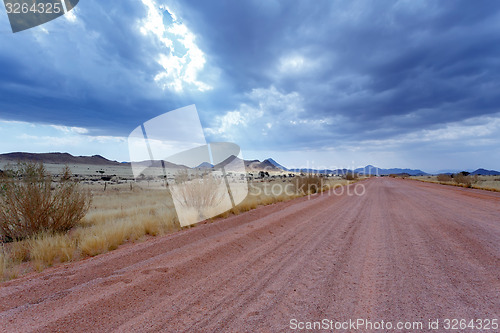 Image of endless road in Namibia moonscape landscape