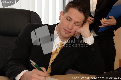 Image of Businessman writing
