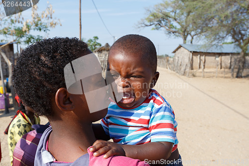 Image of Crying namibian child with mother