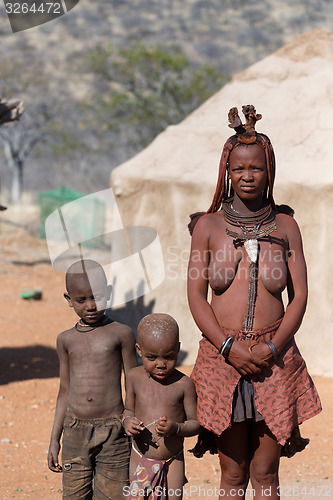 Image of Himba woman with childs in the village