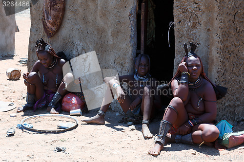 Image of Himba woman with child in the village