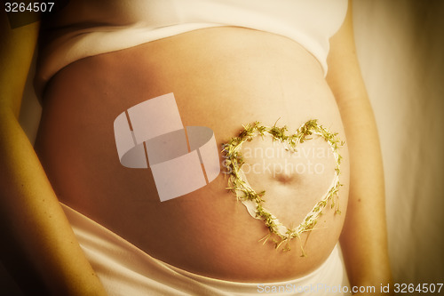 Image of cress heart on baby bump