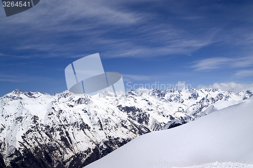 Image of Off-piste slope and snowy mountains