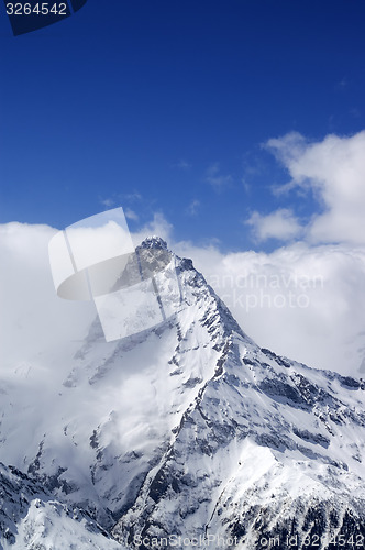 Image of Snowy mountains in clouds