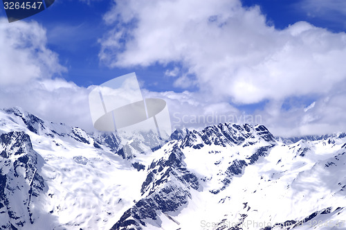 Image of Snowy mountains in sun day