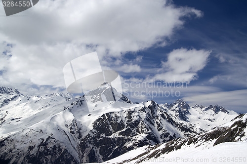 Image of Snowy mountains and sky with clouds