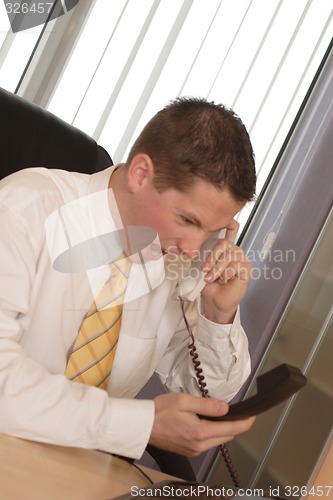 Image of Businessman shouting on phone