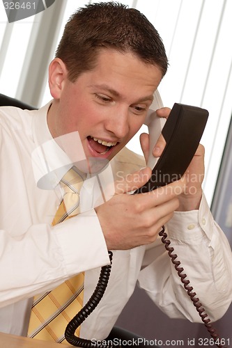 Image of Businessman shouting on phone