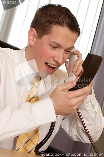 Image of Businessman shouting on phone