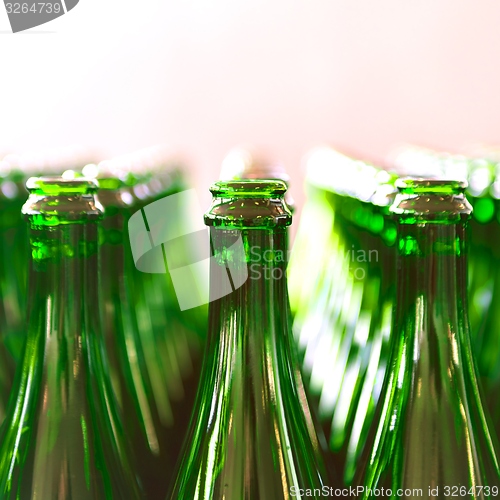 Image of Many bottles on conveyor belt