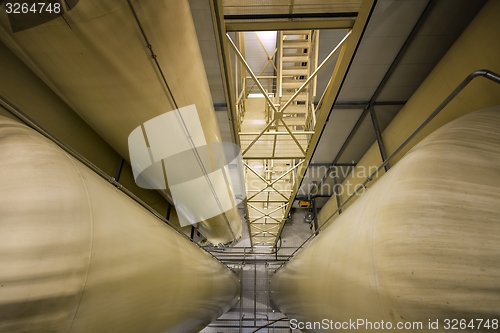 Image of Industrial interior with welded silos