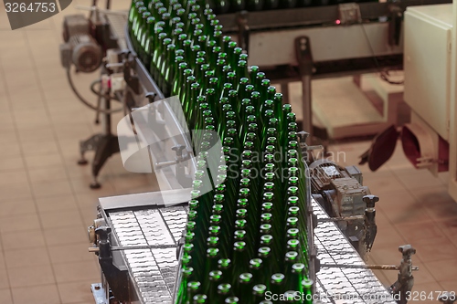 Image of Many bottles on conveyor belt