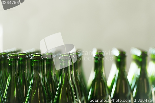 Image of Many bottles on conveyor belt