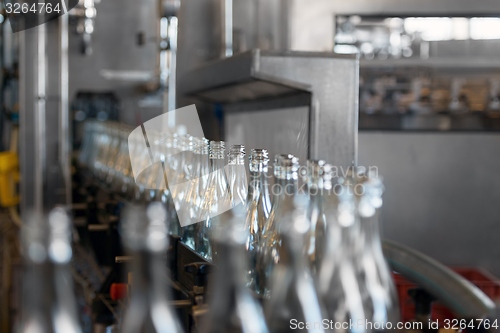 Image of Many bottles on conveyor belt