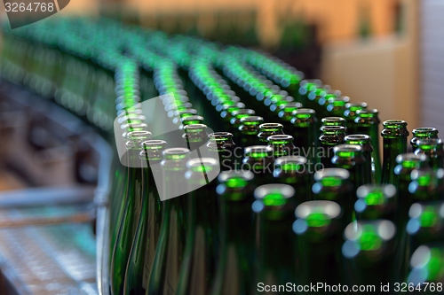 Image of Many bottles on conveyor belt