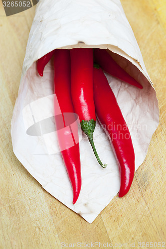 Image of red hot chili peppers in paper bags