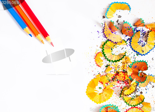 Image of colored shavings and pencils on white