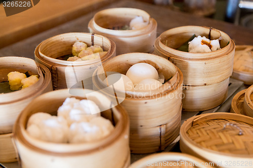 Image of meat or rice balls in wooden containers