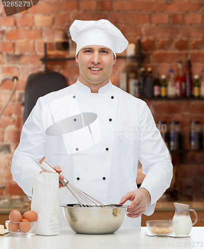 Image of happy male chef cook baking